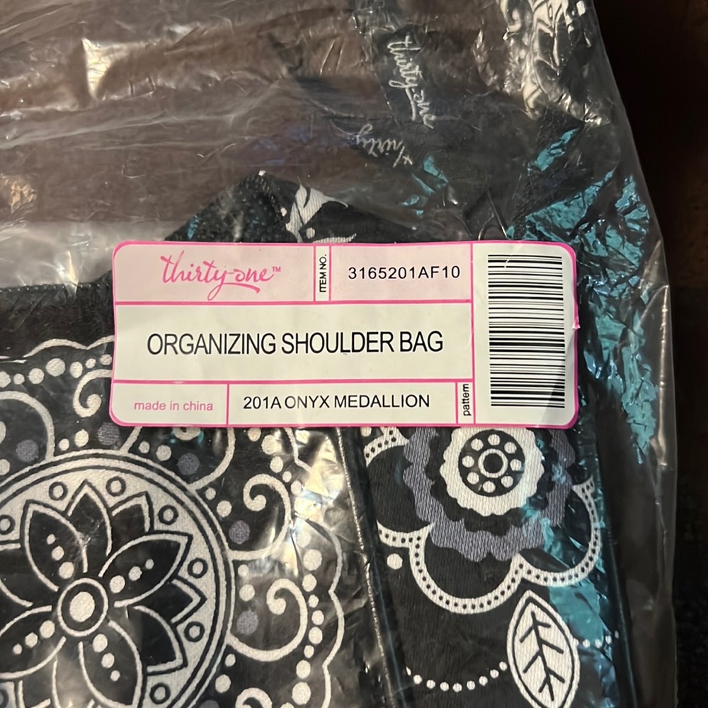 Brand new still in package. Thirty one crossover bag